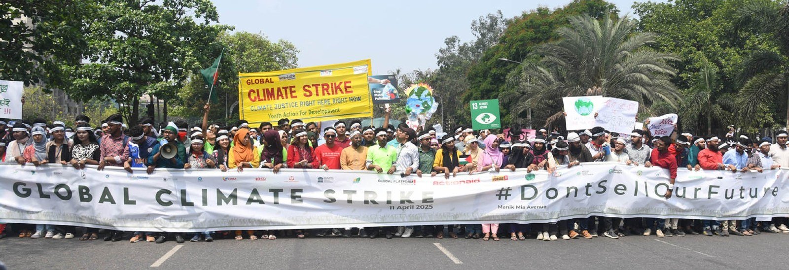 Young climate activists taking part in a climate strike on Manik Mia Avenue in Dhaka, Bangladesh