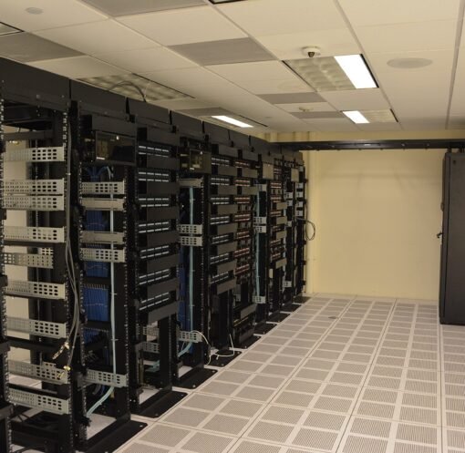 Rows of illuminated server racks in a modern data center