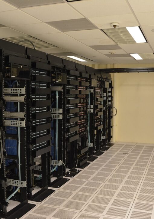 Rows of illuminated server racks in a modern data center