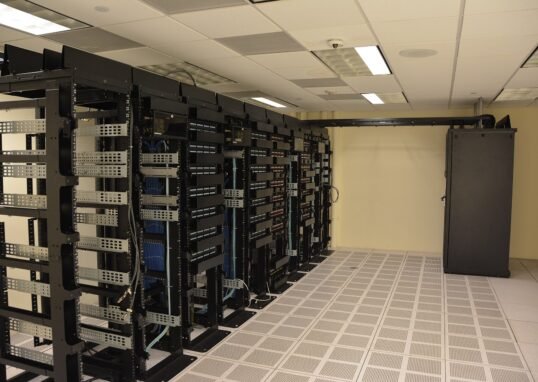 Rows of illuminated server racks in a modern data center