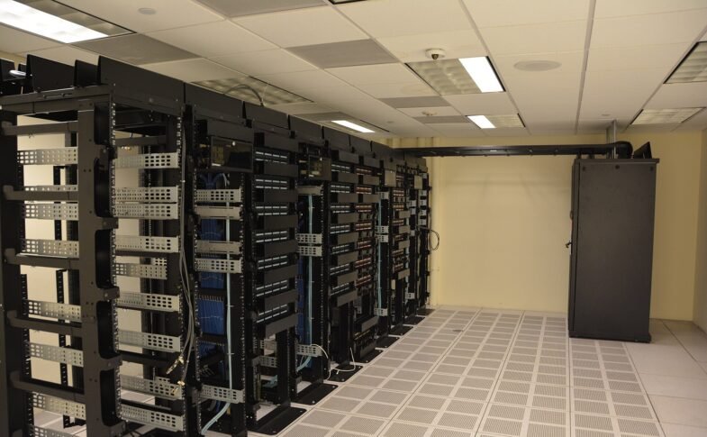 Rows of illuminated server racks in a modern data center