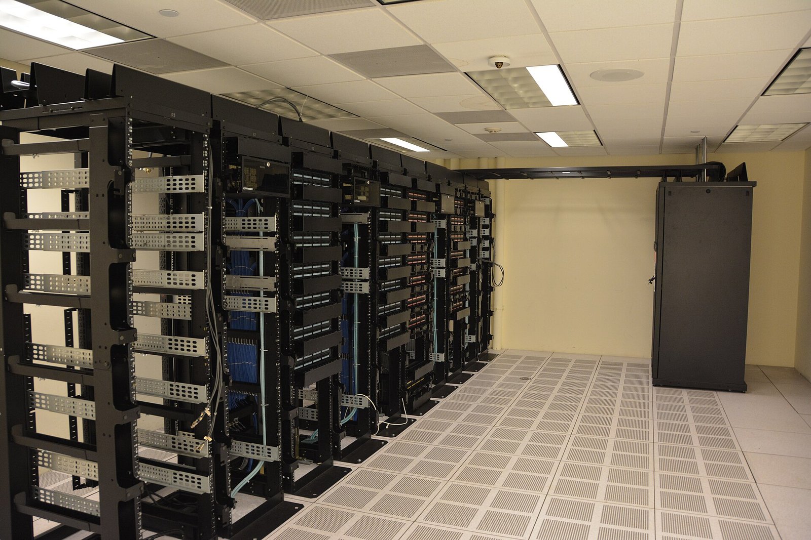 Rows of illuminated server racks in a modern data center