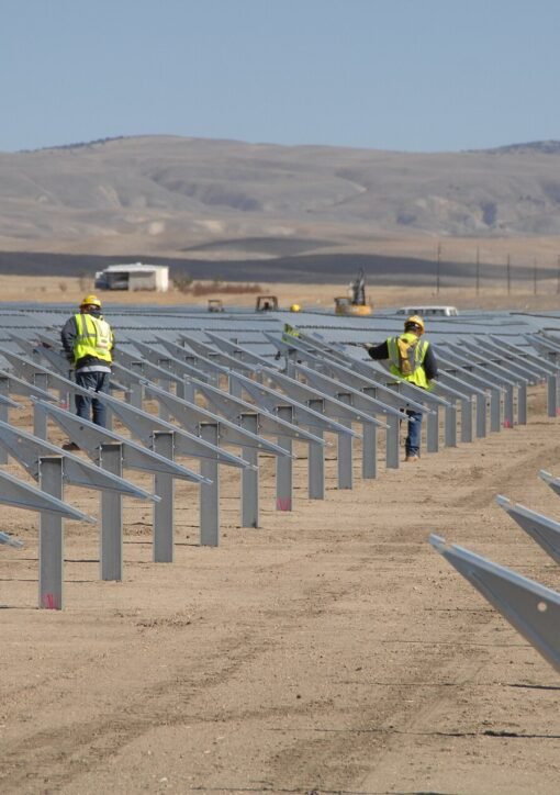 Landscape view of Topaz Solar Farm with rows of solar panels under maintenance