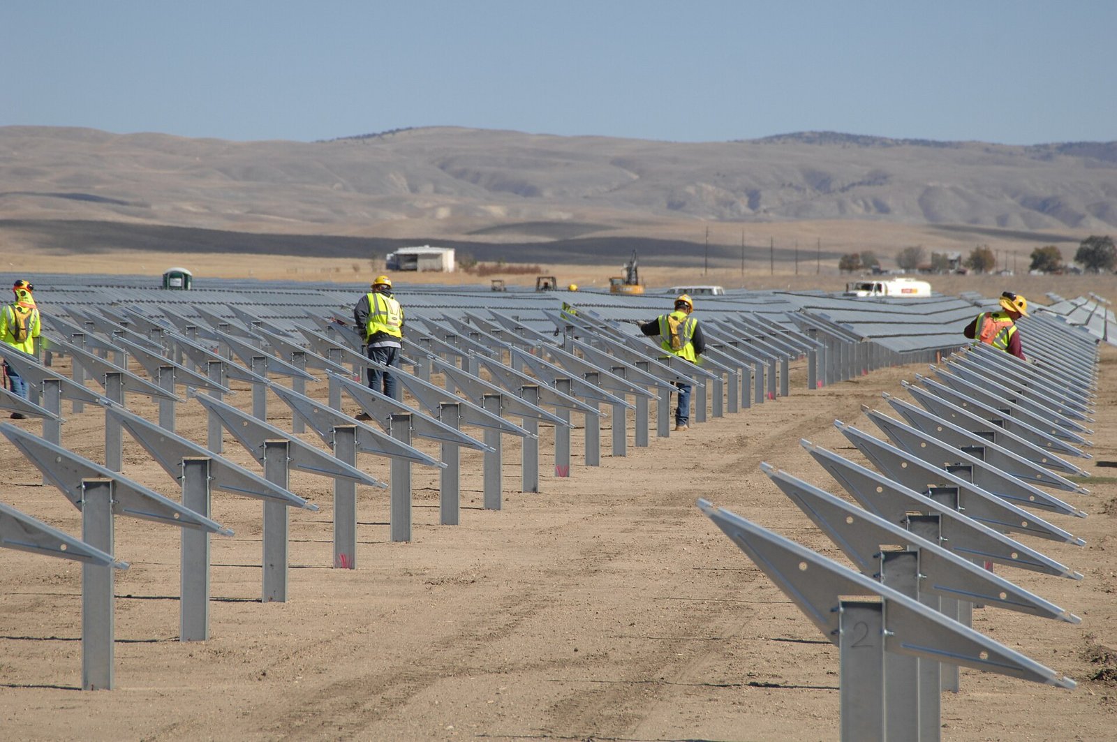 Landscape view of Topaz Solar Farm with rows of solar panels under maintenance