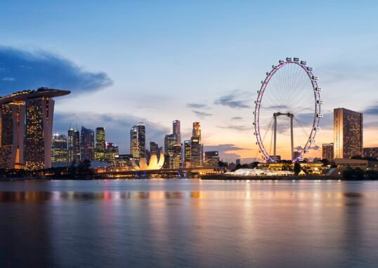 Singapore skyline at sunset viewed from Gardens by the Bay East