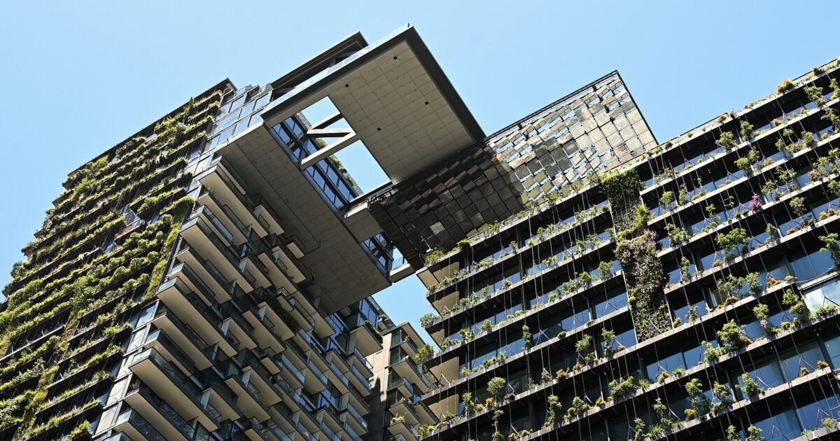 Landscape view of One Central Park Sydney residential towers with green facades