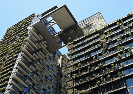 Landscape view of One Central Park Sydney residential towers with green facades