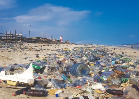 Landscape view of plastic waste covering a beach in Accra, Ghana