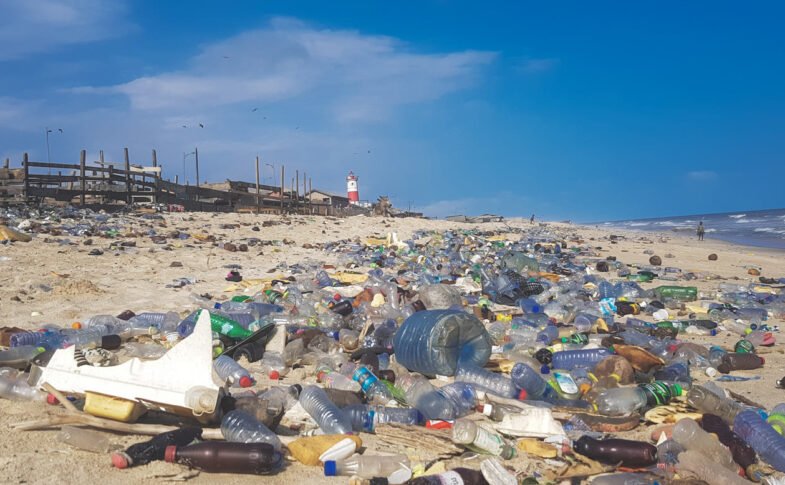 Landscape view of plastic waste covering a beach in Accra, Ghana