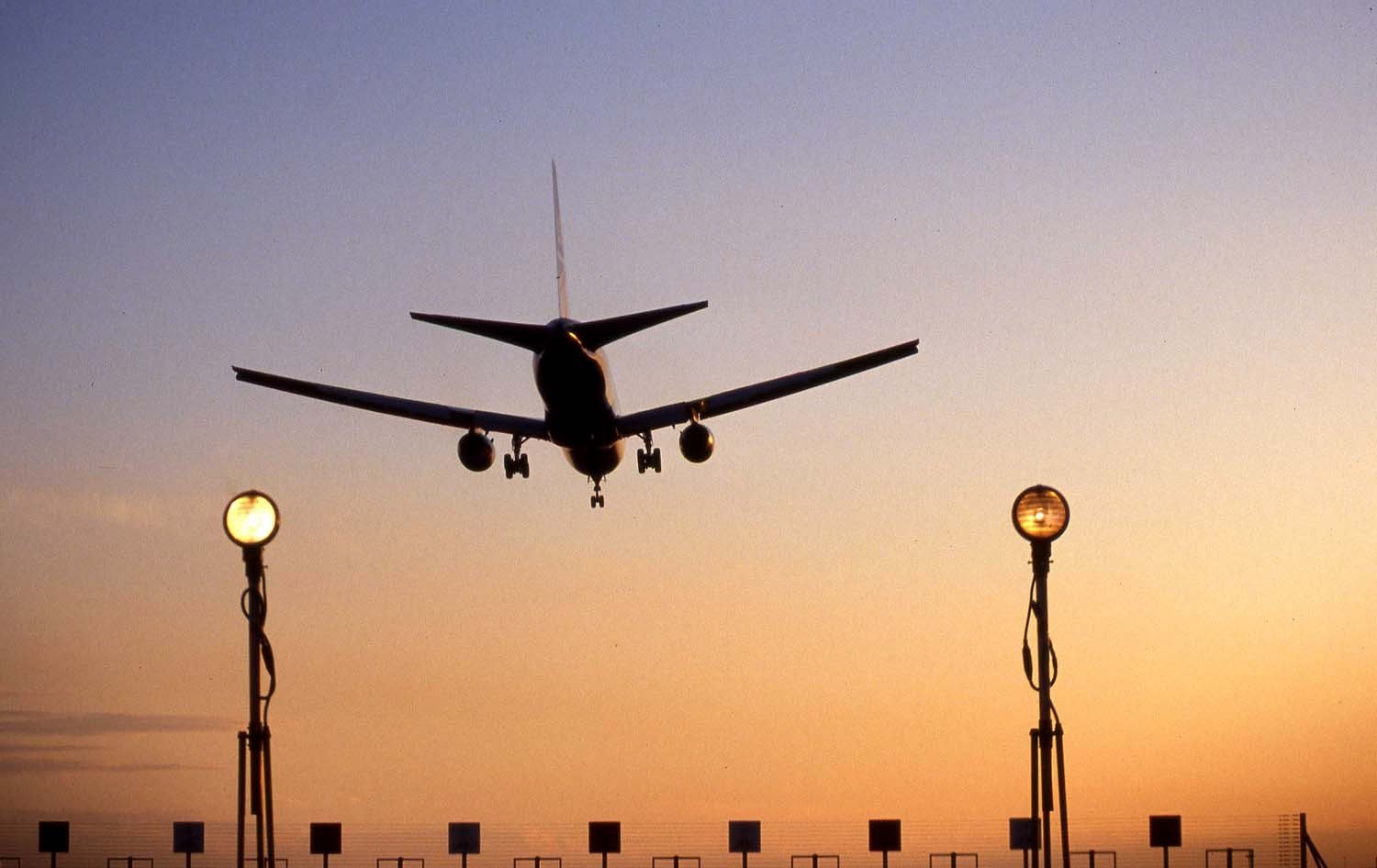 An aircraft landing at Heathrow Airport, illustrating aviation activity and emissions