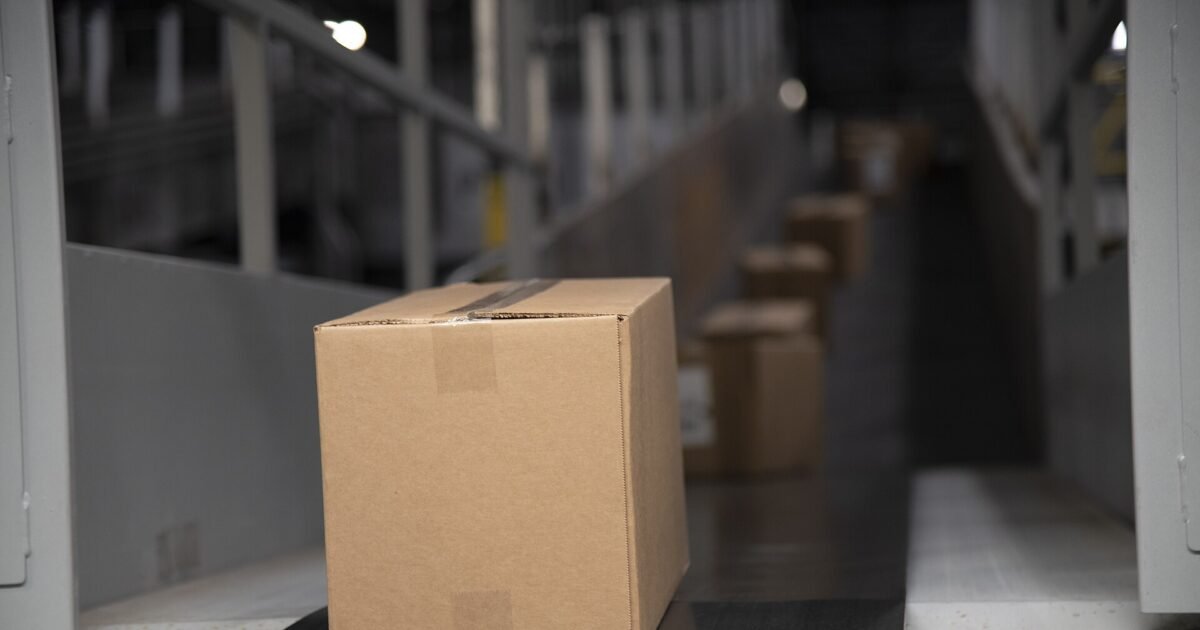 Packages on a warehouse conveyor belt