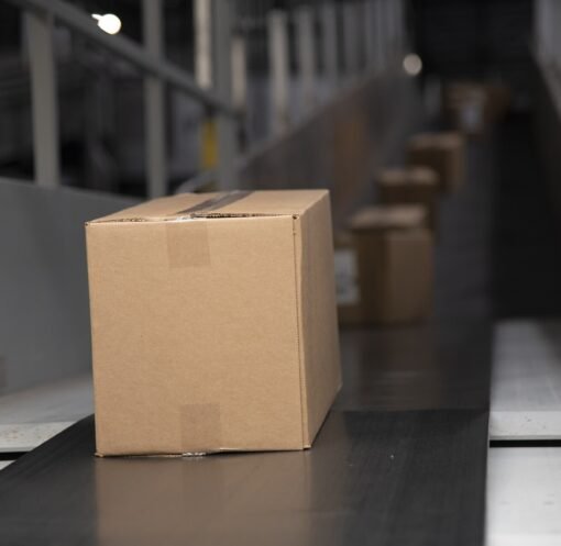 Packages on a warehouse conveyor belt