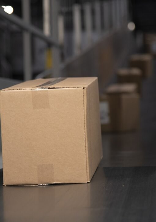 Packages on a warehouse conveyor belt