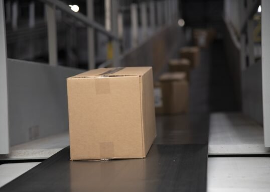 Packages on a warehouse conveyor belt