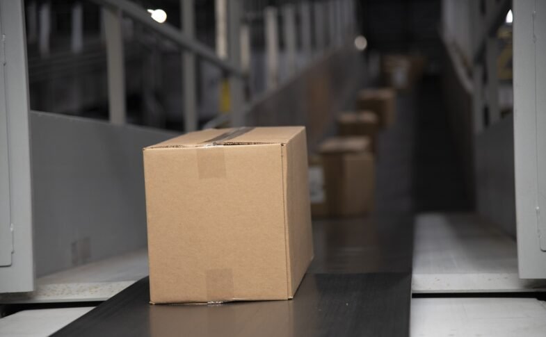 Packages on a warehouse conveyor belt