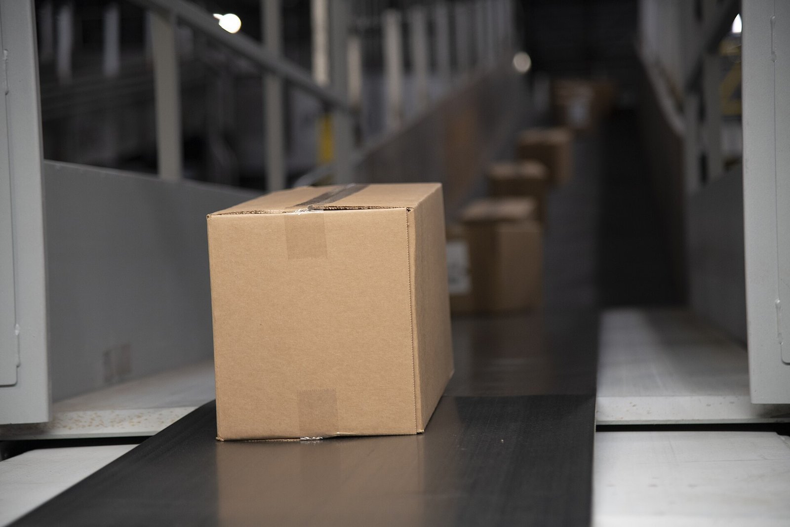 Packages on a warehouse conveyor belt