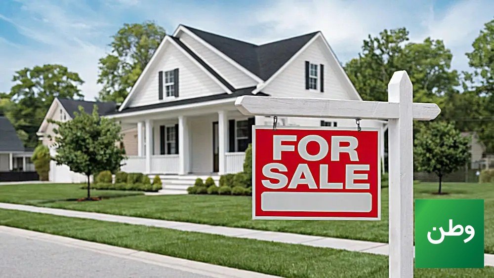 For sale sign in front of a suburban house as US home sellers cut prices