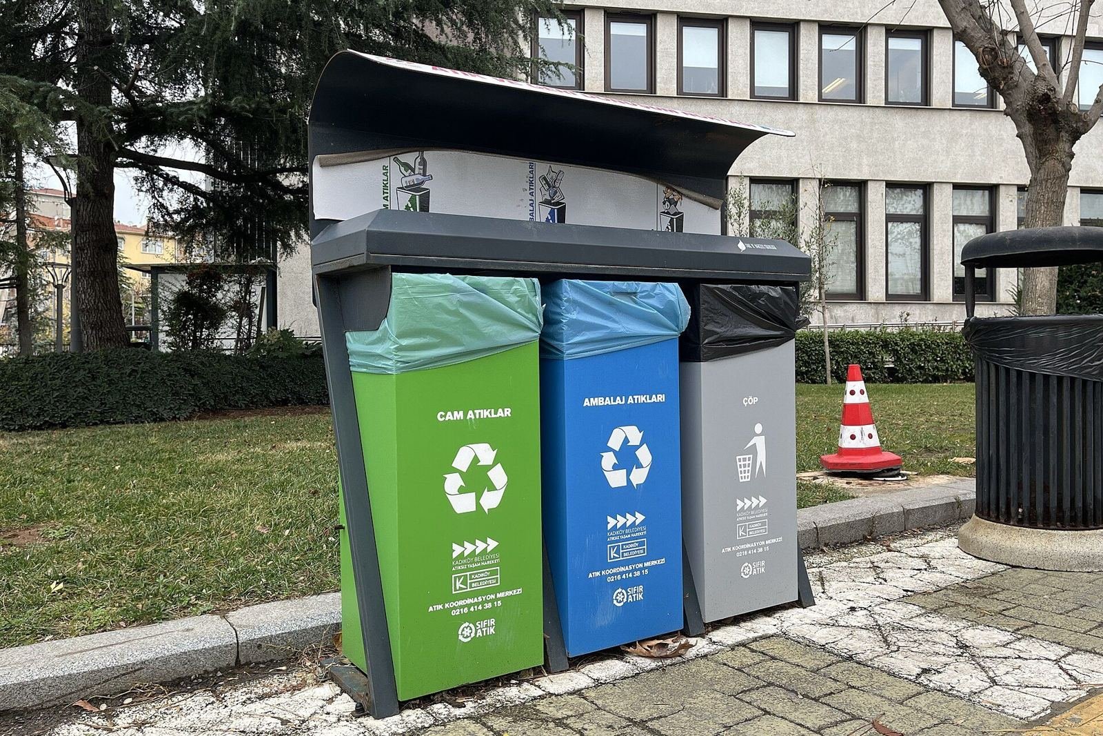 Colour-coded zero waste recycling bins for glass, packaging and general waste outside Kadikoy Municipality in Istanbul