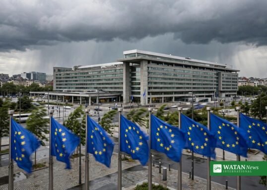 European Union flags in front of an EU institution building in Brussels under dramatic clouds ahead of COP31 climate negotiations