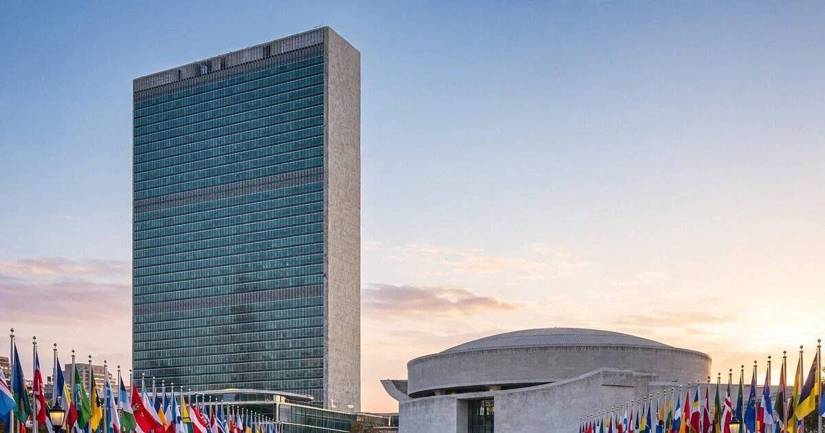 United Nations headquarters in New York with rows of national flags at sunset during UNGA high-level week
