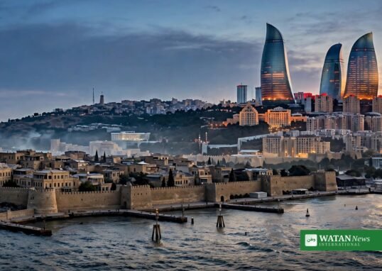 Baku Azerbaijan skyline at dusk with the Caspian Sea and Flame Towers