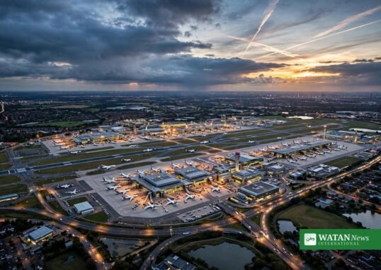 Heathrow expansion climate test: aerial view of London Heathrow Airport at dusk