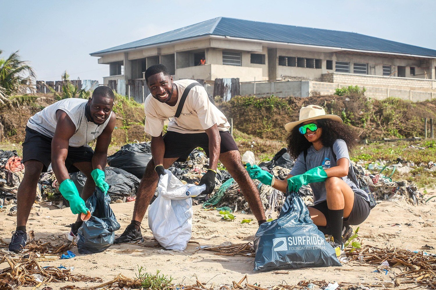 Volunteers collect plastic waste during a beach cleanup in Ghana