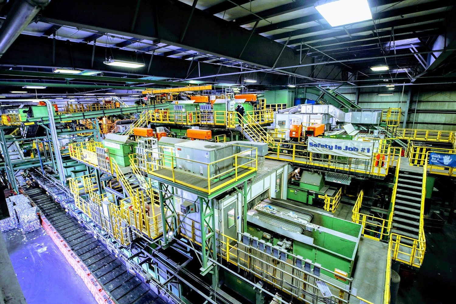 A materials recovery facility separates waste on conveyor belts in New York City