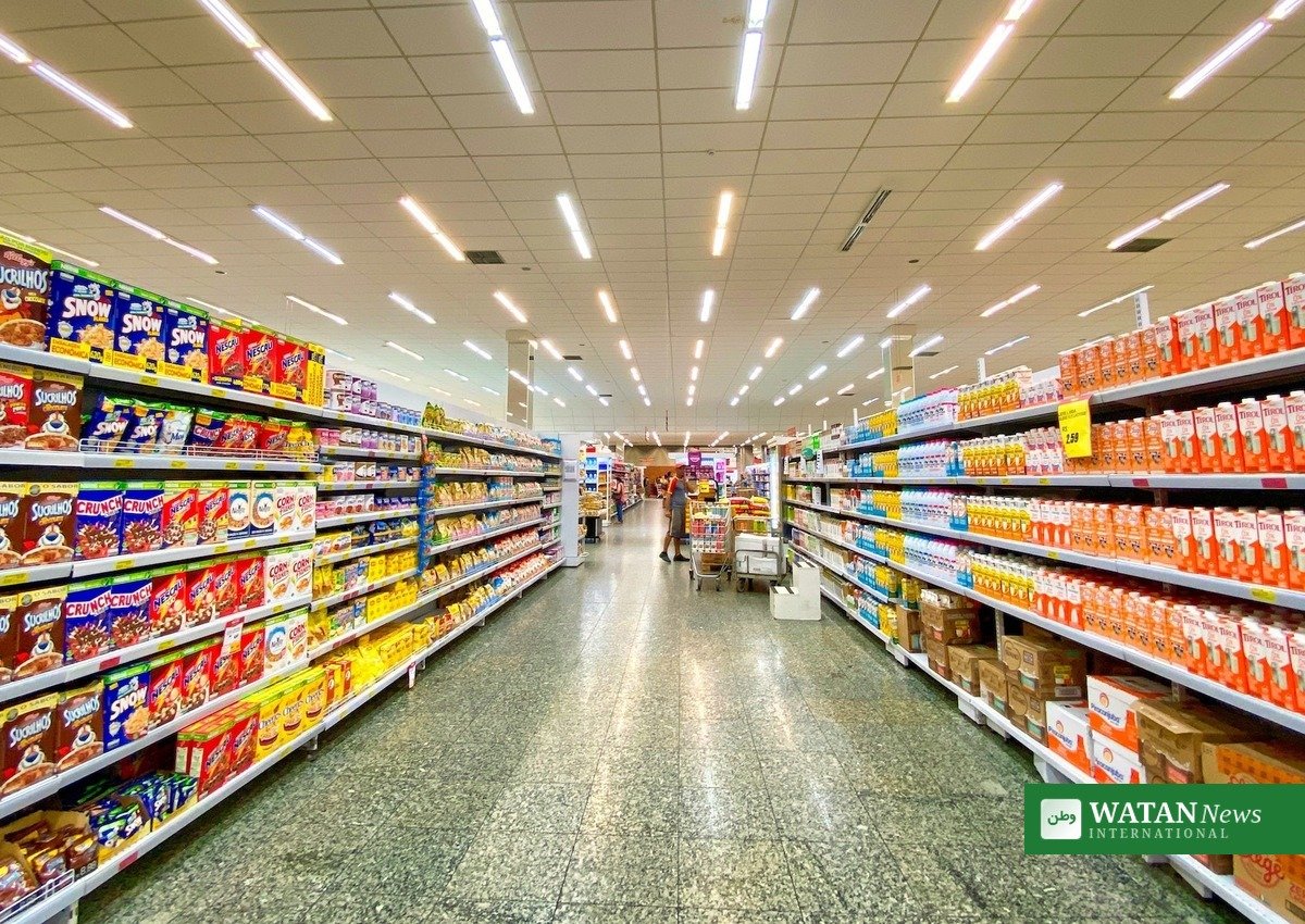 Shopper with a cart in a supermarket aisle, food safety confidence