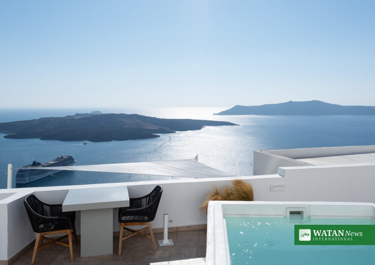 Santorini luxury hotel terrace with plunge pool overlooking caldera