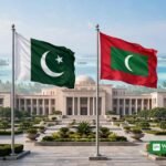 Pakistan Maldives trade target — Pakistan and Maldives flags at a government building in Islamabad