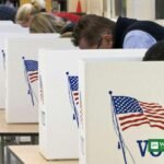 Voters casting ballots at voting booths in the United States