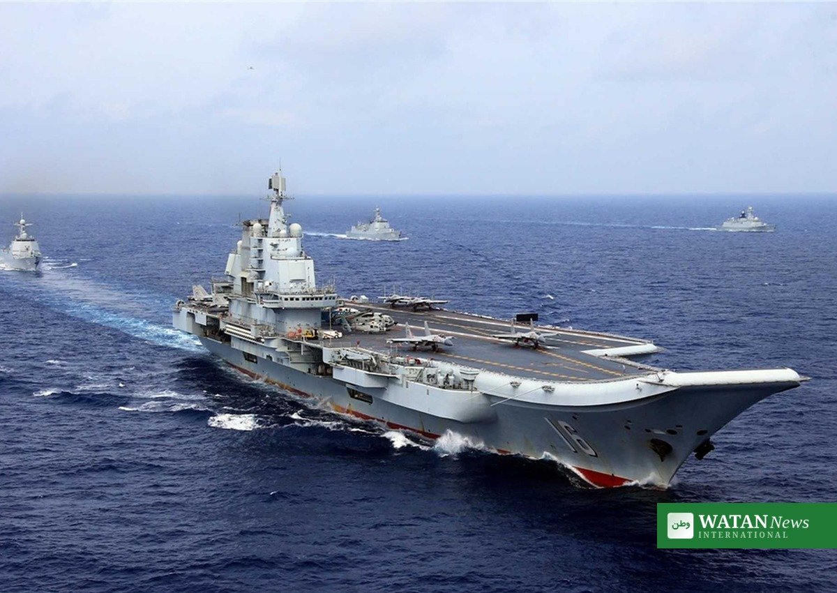 Chinese aircraft carrier Liaoning sailing at sea with escort warships