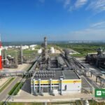Russian oil refinery with storage tanks and chimneys