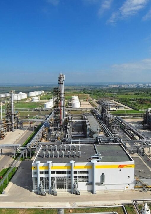 Russian oil refinery with storage tanks and chimneys