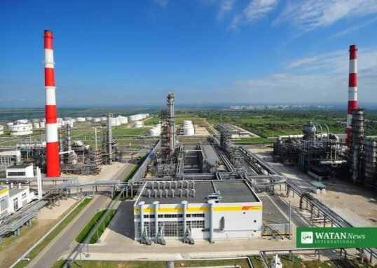Russian oil refinery with storage tanks and chimneys