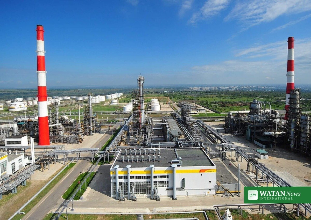 Russian oil refinery with storage tanks and chimneys