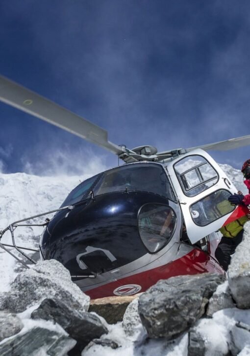 Helicopter in the snow-covered Himalayan mountains