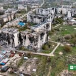 Damaged apartment blocks in the besieged town of Oleshky, Ukraine