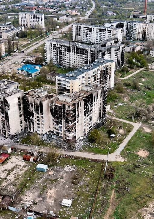 Damaged apartment blocks in the besieged town of Oleshky, Ukraine