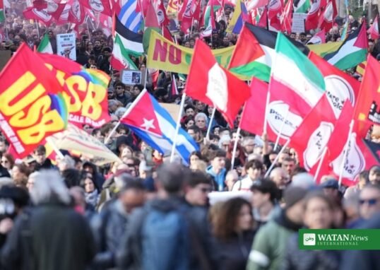 Demonstrators carrying USB union flags at a march in Italy
