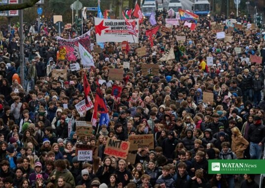 Young demonstrators march through Berlin during a student protest