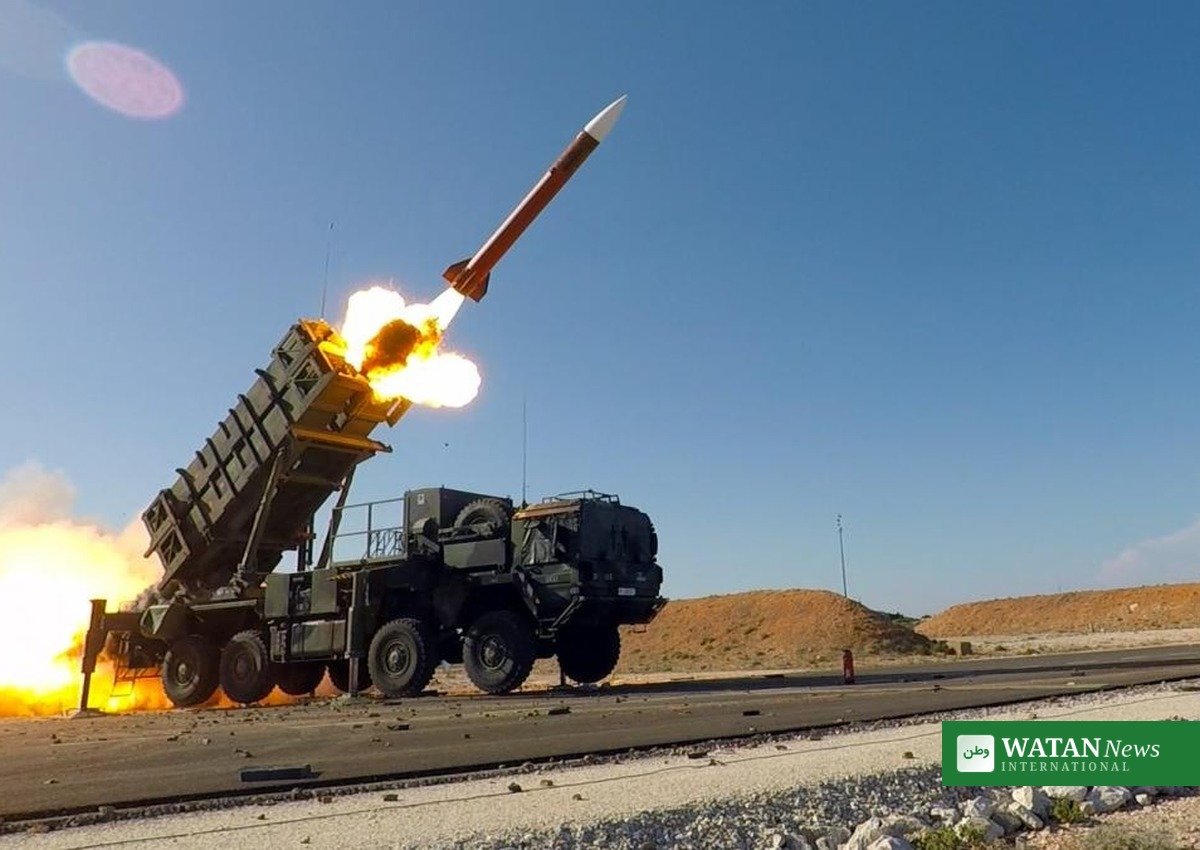 Patriot missile launcher firing an interceptor missile