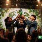 Young climate champions holding a green award trophy on stage at the 2026 Brower Youth Awards