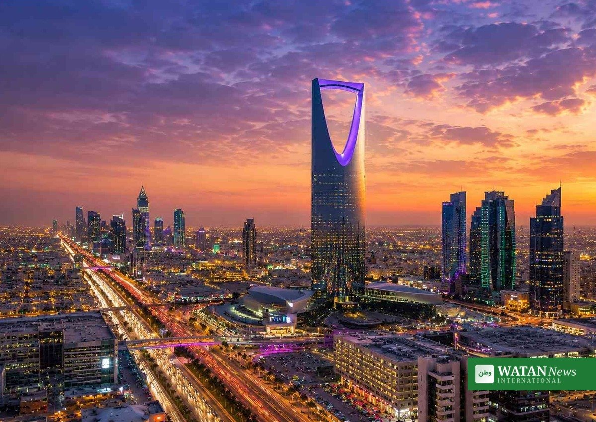 Riyadh skyline at dusk, with the Kingdom Tower lit against the evening sky