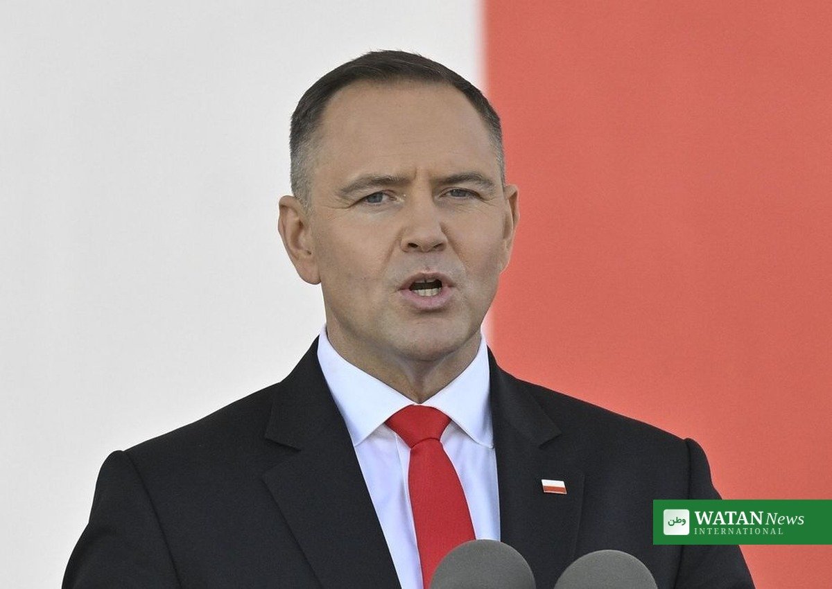 Polish President Karol Nawrocki speaking at a podium