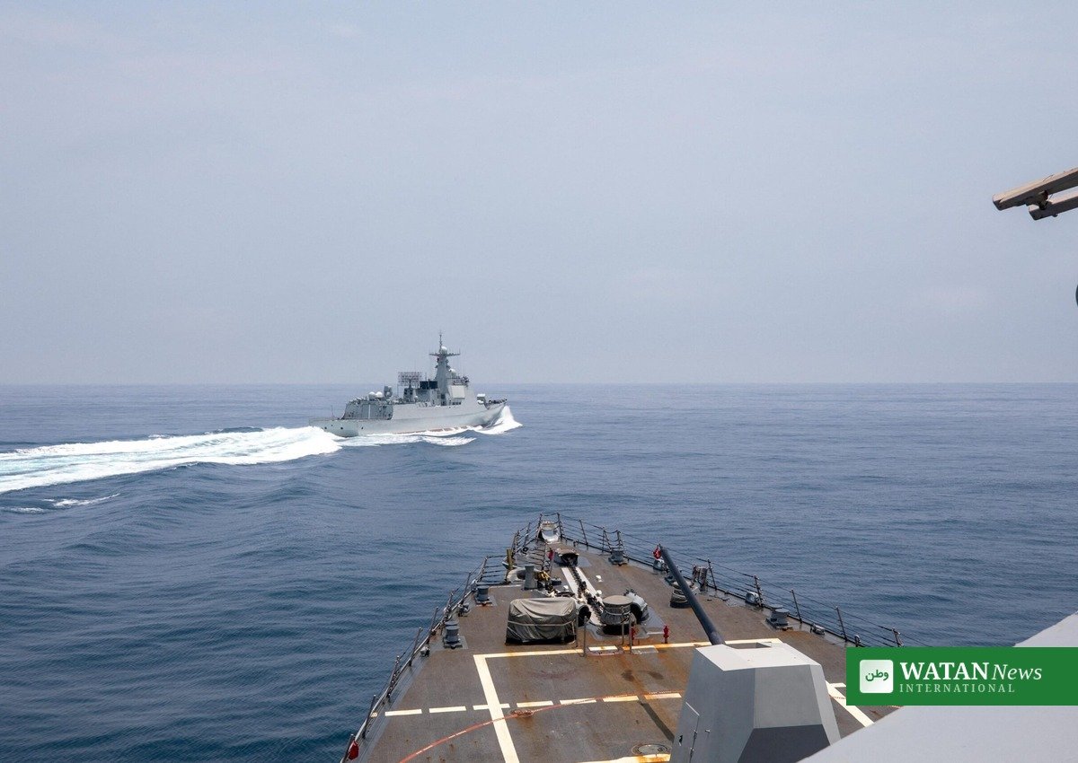 Chinese warship sailing at sea viewed from another vessel