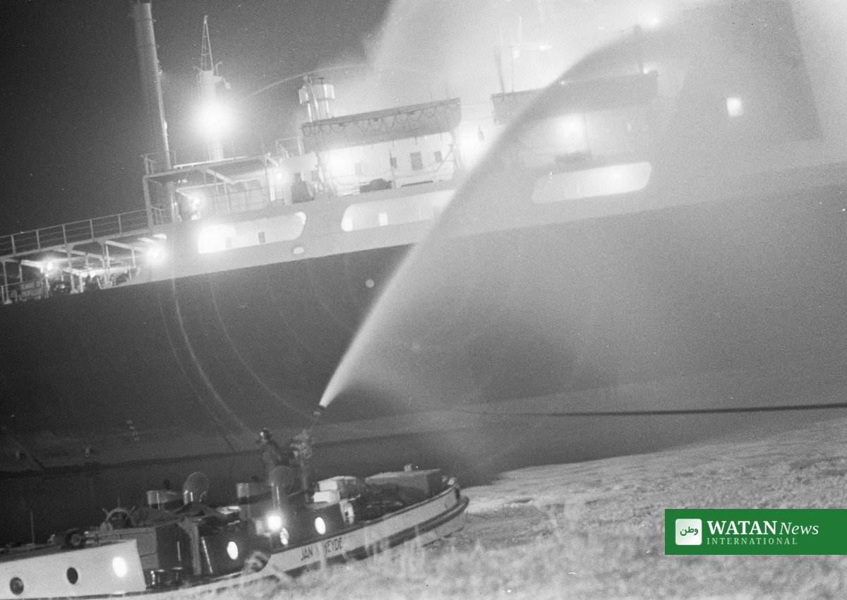 Gulf of Oman tanker fire — fireboat crew dousing a burning tanker