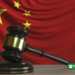 Chinese court gavel with China flag — China kindergarten lead poisoning verdict