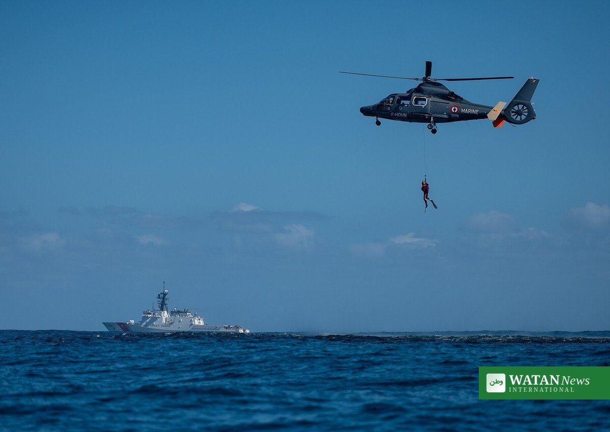 California smuggling boat rescue — U.S. Coast Guard cutter and search-and-rescue helicopter at sea